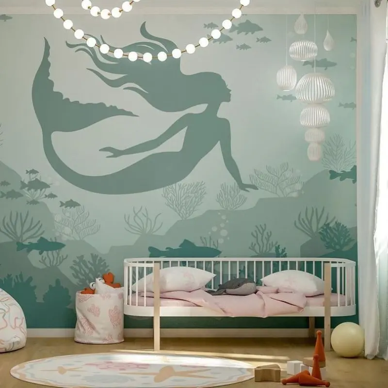 Cartoon animal wall above nursery crib