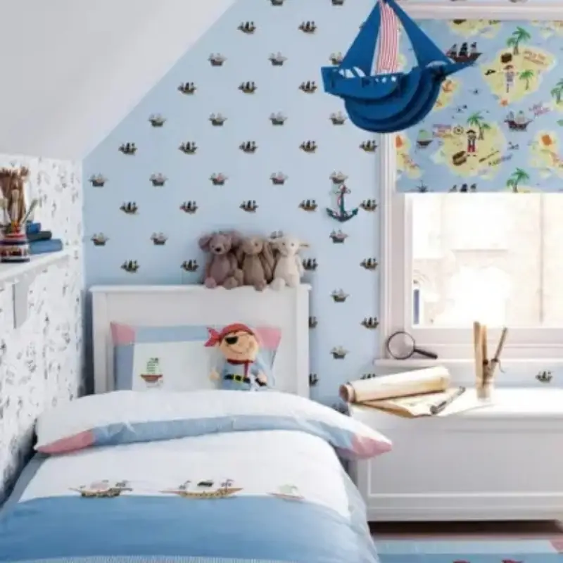 Workers fitting wallpaper in nursery